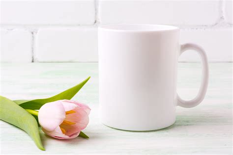 Download White coffee and cappuccino mug mockup with magenta tulip
